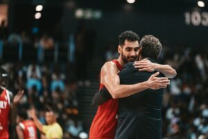 Ehab Amin hugs coach